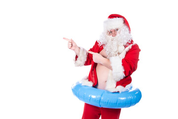 Vacations and holidays. Funny Santa Claus with an inflatable ring dreams of the sea. White background.
