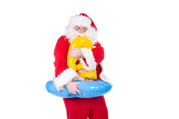Vacations and holidays. Funny Santa Claus with an inflatable ring dreams of the sea. White background.