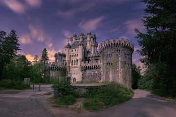 Fototapeta premium View of the road and the main façade of Butron Castle in Gatika in the moonlight