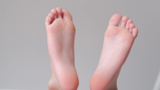 legs of a 9 year old boy having fun lying on the sofa