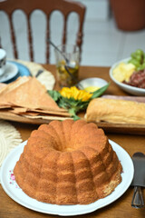cake on a wooden table, cake on a plate, breakfast table, afternoon tea, simple cake, homemade cake, fluffy cake, egg cake
