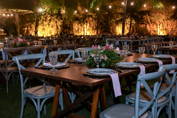 table set for a dinner, restaurant in the city, cafe in the city, restaurant in the night, restaurant tables and chairs, restaurant tables in the garden, hanging lights, christmas tree at night
