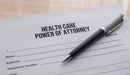 pen and power of attorney form about health care on the table 