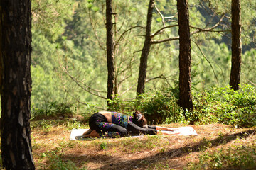 Yoga postures by professional yoga practitioner, elegant yoga poses to celebrate yoga day, perfect combination of yoga and the nature. 