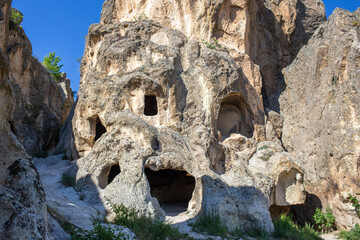View of the residential areas, tombs and chapels carved from the bedrock in Ayazini Village in the Phrygian Valley