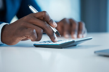 Corporate, black man and hand with calculator on desk for planning budget and company audit for tax bills. African guy, accountant and counting machine in business office for financial management
