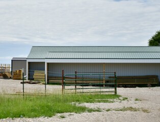 Fence and Gate by a Metal Barn