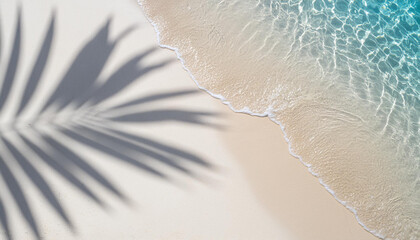 Palm leaf shadow on abstract white sand beach background with sunlight in water wave from above beautiful summer vacation concept with copy space