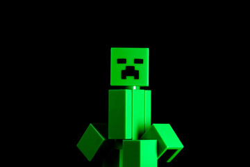 Naklejka premium LEGO Minecraft green Creeper Mob on the black background