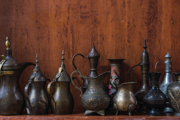 Traditional Omani metalware on wooden background