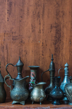 Traditional Omani metalwork on a wooden background