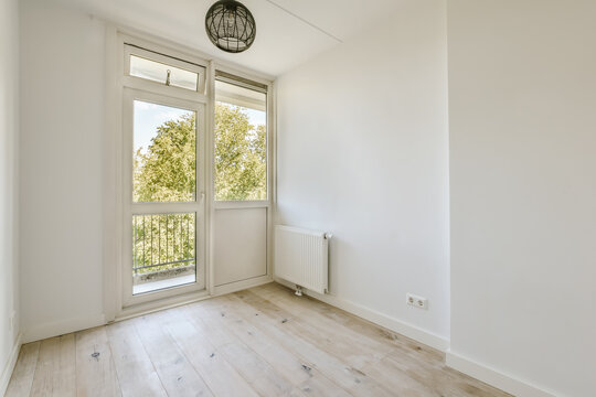 Bright empty room with window view of nature