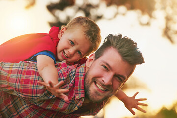 Man, child and piggyback for airplane in portrait for fun, fantasy or development in garden. Young...