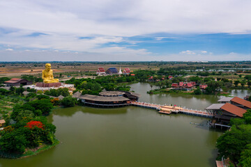 Obraz premium Aerial panorama view of temple located near big pond, Thailand. 