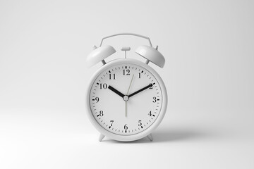 White alarm clock on white background in monochrome and minimalism. Illustration of the concept of morning calls, timelines, schedules and punctuality