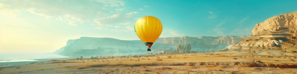 Naklejka premium Sunrise Adventure in Desert: Soaring Hot Air Balloon Captures the Spirit of Freedom