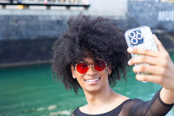 Capturing Style: Non-Binary Self-Portrait with Red Glasses and a Smile