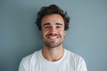 Obraz premium A close up portrait of a young man with a subtle smile