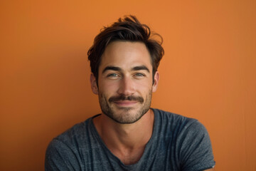 Obraz premium A close up portrait of a young man with a subtle smile