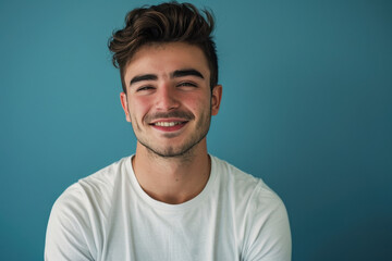 Fototapeta premium A close up portrait of a young man with a subtle smile