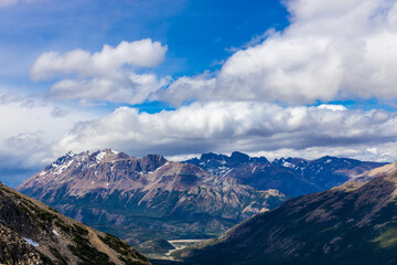 Patagonia mountains in El Chalten, Argentina. Monte Fitzroy and Cerro Torre summits granite walls above lake laguna Torre with icebergs floating ice and dark clouds nasty patagonian weather 