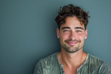 Obraz premium A close up portrait of a young man with a subtle smile