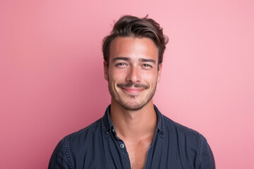 Obraz premium A close up portrait of a young man with a subtle smile