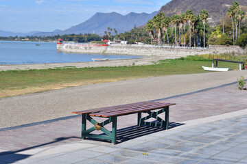A diagonal view from a bench on Chapala's pier captures the stark beauty of a partially dry lake,...