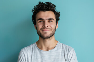 Fototapeta premium A close up portrait of a young man with a subtle smile