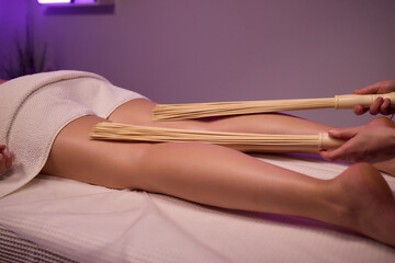 Experience relaxation and muscle relief with a spa treatment using bamboo sticks for rejuvenation