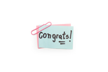 Post it celeste con la palabra felicitaciones sobre un fondo blanco aislado. Vista superior y de...