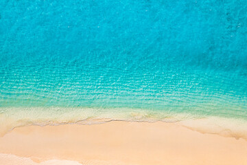 Relaxing aerial beach scene, summer vacation holiday template banner. Waves surf with amazing blue ocean lagoon, sea shore, coastline. Perfect aerial drone top view. Peaceful bright beach, seaside
