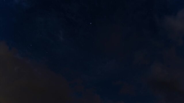 night timelapse. starry sky. cloudy sky. starlink flying satellites