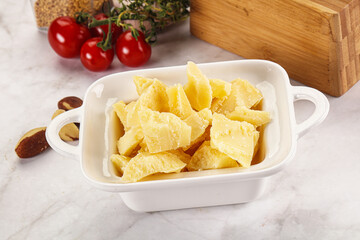 Crushed parmesan cheese in the bowl