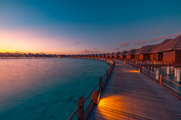 Amazing travel beach luxury landscape. Beautiful Maldives tourism sunset seascape view. Horizon...