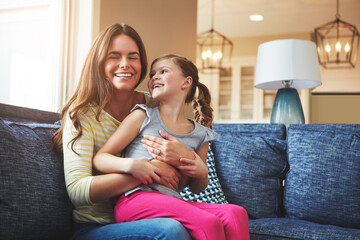 Child, woman and hug with love on sofa house for playful, bonding and support of relationship moment. Smile, mother and girl as family for care, security or relax with embrace on couch for childhood