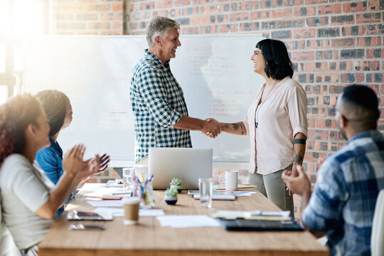 Man, woman and shaking hands for welcome to startup with smile, support and introduction to team on office. Business people, leader and handshake with new employee with deal, agreement and applause
