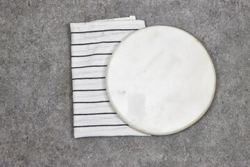 white marble board with napkin on grunge background. Healthy cooking concept with copy space. Top view