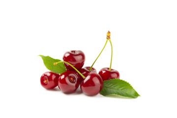 Cherry isolated. Fresh ripe cherries with leaves isolated on a white background.Sweet cherries pile. Berries and fruits. Vegan. Healthy eating.