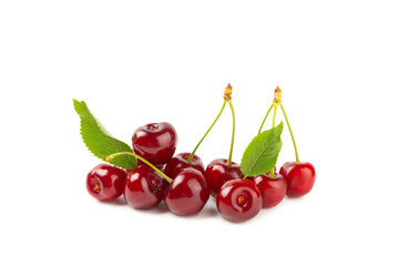Cherry isolated. Fresh ripe cherries with leaves isolated on a white background.Sweet cherries pile. Berries and fruits. Vegan. Healthy eating.
