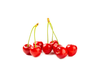 Cherry isolated. Fresh ripe cherries with leaves isolated on a white background.Sweet cherries pile. Berries and fruits. Vegan. Healthy eating.