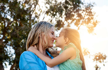 Fototapeta premium Woman, girl and love in backyard for support, care and holiday in countryside with family. Sunshine, mother and child in garden with happiness for springtime, vacation and together in nature