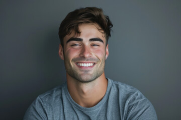 Obraz premium A close up portrait of a young man with a subtle smile