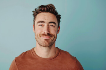Obraz premium A close up portrait of a young man with a subtle smile