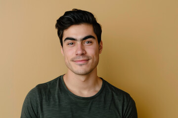 Obraz premium A close up portrait of a young man with a subtle smile