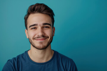 Fototapeta premium A close up portrait of a young man with a subtle smile
