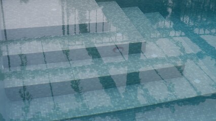 Stairs under clear blue water lead down to the outdoor pool.