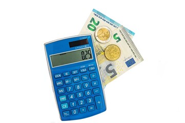 Calculator with euro coins on paper euro banknotes. Isolated white background.