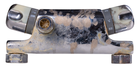 Old shower faucet with thermal regulator on isolated background.