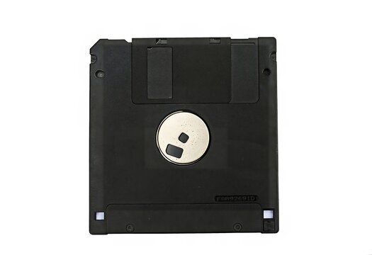 Old 3.5-inch floppy disk or diskette isolated on white background